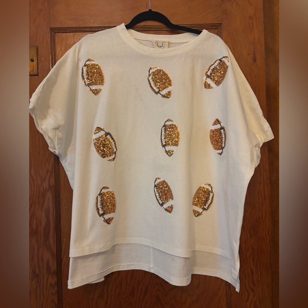 Fantastic Fawn Gold glitter sequin football motif on a white  T-shirt . Size L